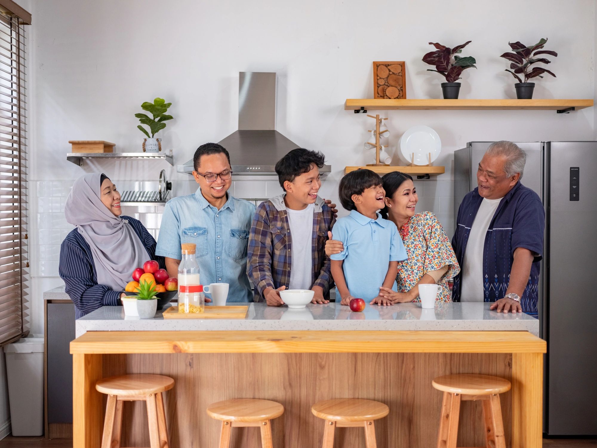 happy multigenerational family at home kitchen